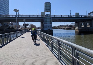Bicyclists on a ramp by river. Credit City of Philadelphia