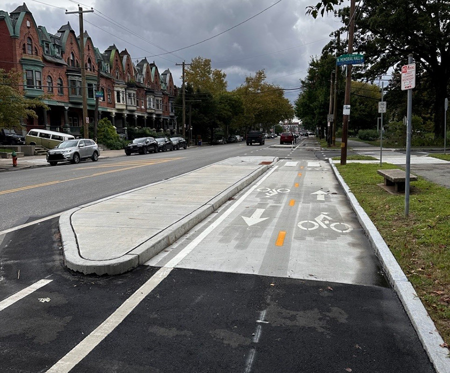 Street in Philadelphia with two way cycle track and concrete bus boarding area. Credit City of Philadelphia