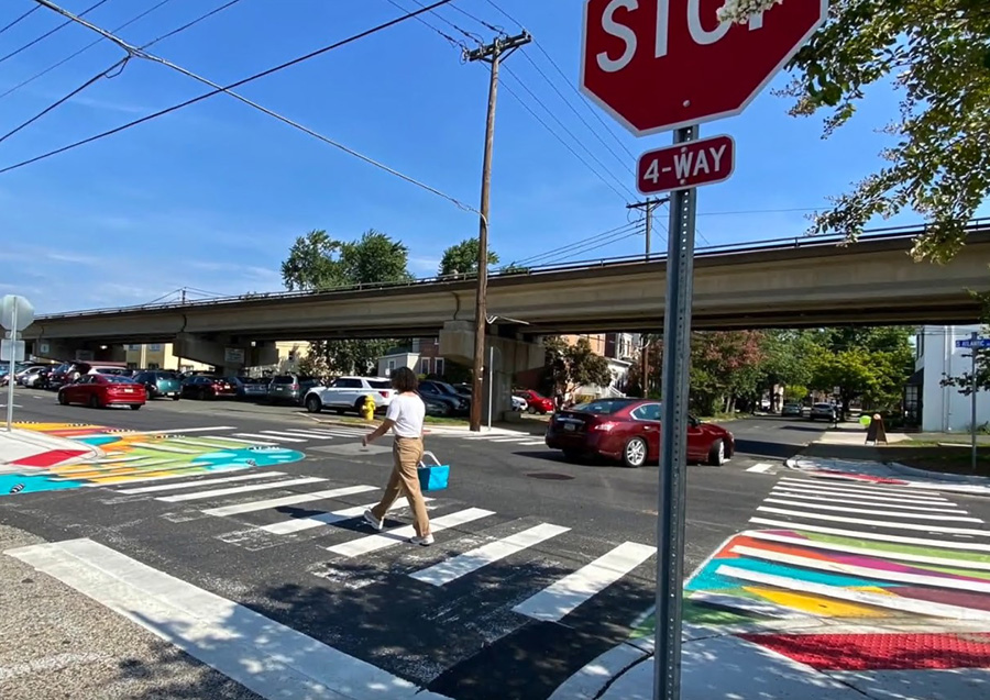 person in colorful crosswalk