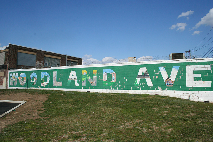 Mural along wall says Woodland Avenue. Credit: 2023 Studio1 Students at Stuart Weitzman School of Design