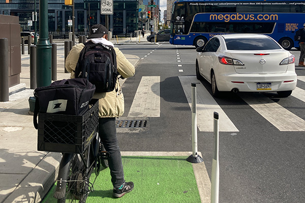 bicycle rider at an intersection in Philadelphia. Credit DVRPC