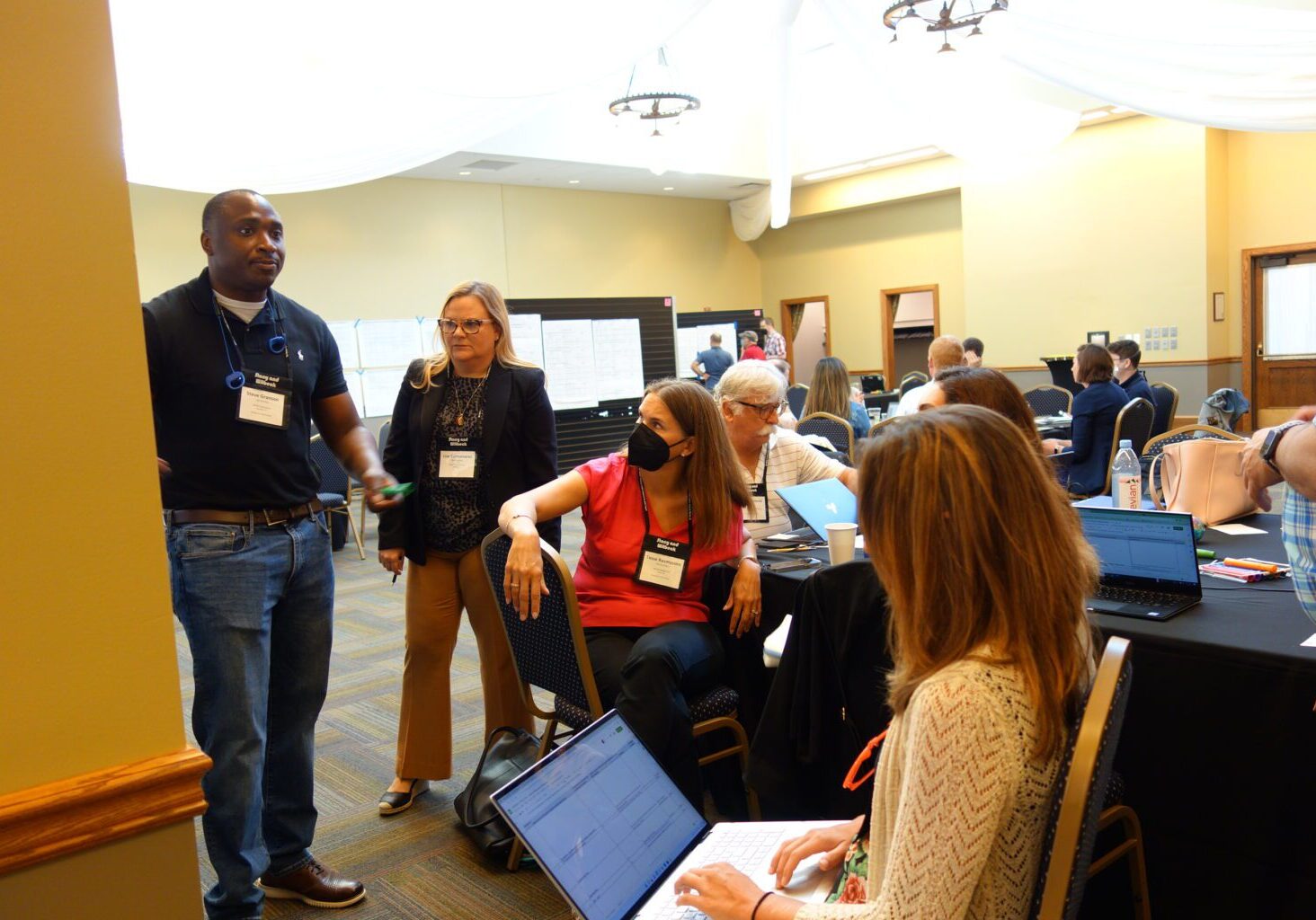 Attendees conversing with one another